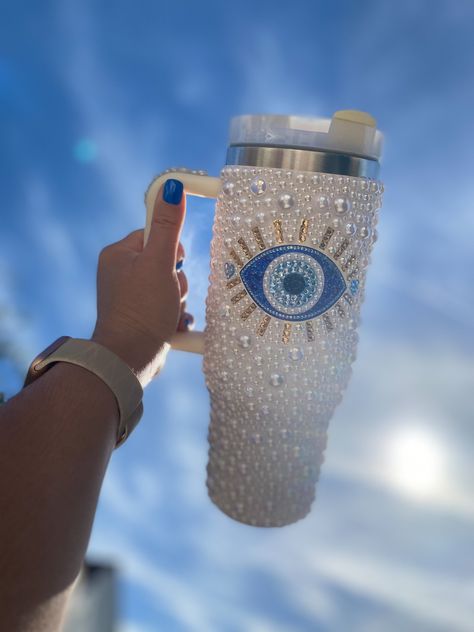 This huge 40oz insulated water bottle with handle is beautifully embellished with  - Hundreds of carefully handplaced pearls and crystals - A huge blinged Turkish evil eye to protect you from bad vibes and Invite good luck - Fully insulated to keep cold drinks cold and hot drinks hot - Name can be added if requested Stanley Cup Bling, Blinged Cups, Bedazzled Things, Rhinestone Tumblers, Trendy Water Bottles, Rhinestone Cups, Rhinestone Projects, Cute Coffee Cups, Baby Announcement Cards