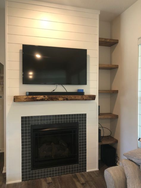 Live edge Spruce mantle using Walnut Danish Oil. Shelves are pine and Walnut Danish Oil. Ship lap and ceramic mosaic tile. Shiplap Fireplace With Live Edge Mantle, Fireplace With Live Edge Mantle, Fireplace And Shelves, Live Edge Mantle, Live Edge Fireplace, Christina El Moussa, Ship Lap, Shiplap Fireplace, Ceramic Mosaic