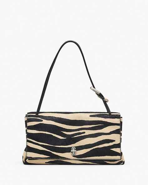 First featured on the Fall ’23 runway, The Large Dual Bag radiates minimalistic quiet luxury. Crafted in zebra-striped haircalf, this new instant-icon features a J Marc turn-lock closure and a handle-adorning interlocking J Marc, subtly branded with engraving. An elevated essential, style it as a shoulder bag or carry by leather top handle. Shop Marc Jacobs The Zebra Haircalf Large Dual Bag 2024 Bags, Zebra Bag, 23 Runway, Zebra Print Bag, Zebra Canvas, Ab Fab, Sporty Spice, Dream Bags, Fall 23