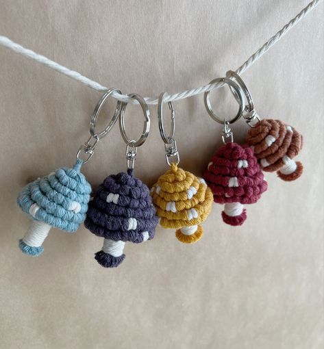 Fun lil fungi! Handmade macrame mushroom keychains - the perfect adornment to bags, purses, backpacks, and more! #macrame #macramekeychains #aesthetic #bohostyle #bohovibes #mushrooms #cottagecore Macrame Mushroom Keychain, Macrame Mushroom, Mushrooms Cottagecore, Mushroom Keychain, Macrame Keychain, Metal Keychain, Handmade Macrame, Macrame Art, Macrame Diy