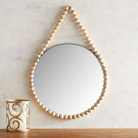 Mirrors - Eclectic and unforgettable. Wearing a "necklace" of wooden beads, our round mirror brings an element of boho style just about anywhere—in the entryway for a ... Boho Mirror, Stone Mirror, Beaded Mirror, Beaded Lamps, Mirror Inspiration, Flourish Design, Unique Gallery Wall, Wooden Bead Necklaces, Wood Wall Mirror