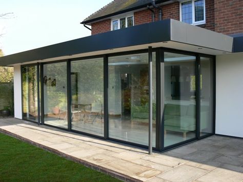 Glass patio enclosure; flat roof Bifold Exterior Doors, Folding Doors Exterior, Folding Patio Doors, Flat Roof Extension, Glass Conservatory, Sliding Glass Doors Patio, Modern Exterior Doors, Glass Doors Patio, Exterior Doors With Glass