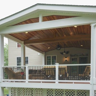 The entire deck is covered with a roof structure to protect it from the weather elements. Pergola Decorations, Screened Porch Designs, Deck Pictures, Building A Porch, Patio Deck Designs, Porch Roof, Pergola Design, Covered Deck, Deck With Pergola