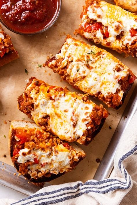 Made with a loaf of easy French bread, this recipe is the perfect at-home dinner to bake in a pinch. The great thing about French bread pizza is that it can be easily customized to whatever you and your family prefer. So bake or buy a loaf of bread, prepare the sauce, and sprinkle on whatever you love to eat, and you have a meal in minutes! | wyseguide.com #pizza #sausage #weeknight #dinner #recipe Sausage French Bread, Bread Meals, Pizza Sausage, Kaleb Wyse, French Pizza, Easy French Bread, Wyse Guide, Sausage Sauce, Sausage Bread