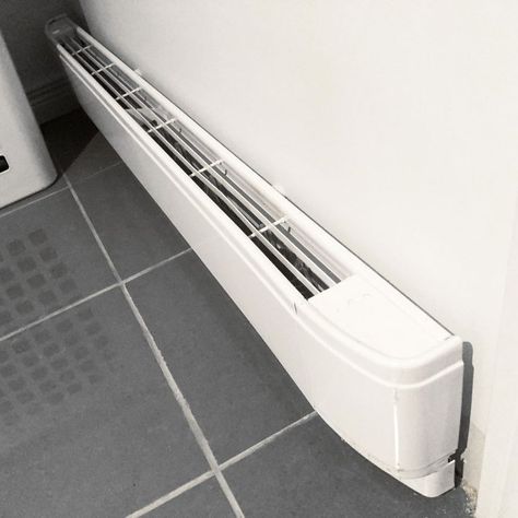 Electric Baseboard Heater Buying Guide | The Family Handyman Heater In Bathroom, Bathroom Baseboard, Hydronic Baseboard Heaters, Baseboard Heaters, Electric Baseboard Heaters, Bathroom Heater, Baseboard Trim, Baseboard Heating, Baseboard Heater