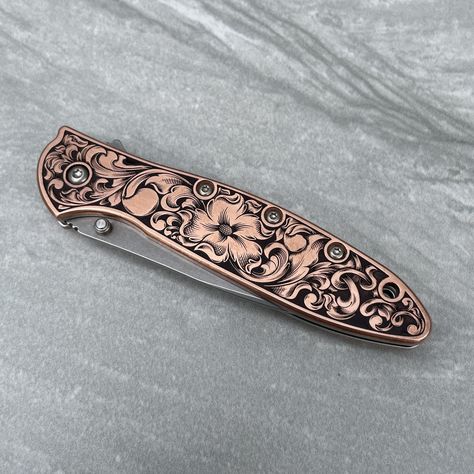 "Laser Engraved, hand finished and antiqued Kershaw Leek - Stainless Steel or Copper scales.  Made in the USA  Specs:  Handle Material: Copper/Stainless Length Open: 7.0\" (17.9 cm) Blade Length: 3.0\" (7.6 cm) Length Closed: 4.0\" (10.3 cm)   Please note that all VAT/customs fees for customers outside the U.S. are the responsibility of the customer." Knife Aesthetic, Engraved Knife, Cowgirl Accessories, Pretty Knives, Dagger Knife, Knife Collection, Cool Swords, Cool Knives, Leeks