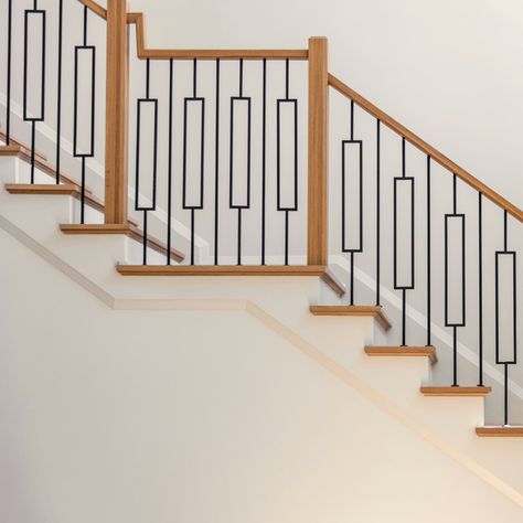 Stair railings matter... They greet your visitors as they enter your home, leaving a lasting impression." Loving the timeless allure of a wrought iron baluster, elegantly finished in sleek black satin, paired with the vibrant tones of a natural red oak wood handrail. #SoulStyle #TheSoulfulHome #InstaHomeDecor, #InteriorInspo, #DesignGoals, #HomeStyle, #InteriorDetails, #DecorCrush, #InstaDesign, #InteriorIdeas, #HomeInspiration, #InteriorStyling, #DesignInspiration, #HomeDecorating, Rot Iron Staircase Railings, Staircase Update, Railing Makeover, Iron Staircase Railing, Stair Railing Makeover, Black Railing, Oak Staircase, Wood Handrail, Iron Staircase