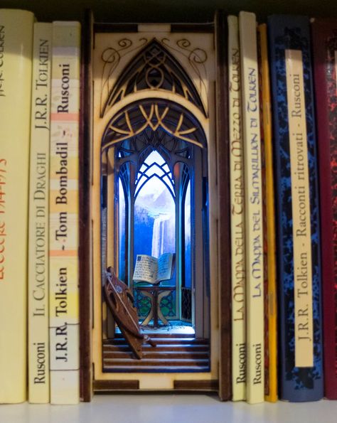 In this edition of Book Lovers Wish List, we’ve discovered the best book nook bookshelf inserts. These one of a kind, handcrafted, and in many cases customizable, book nook bookshelf inserts feature magical settings ranging from secret gardens and alleyways to libraries and reproductions of real-life paintings, plus more. Take your bookshelf to the next level with these amazing diorama book nook bookshelf inserts. #booknookbookshelfinserts #booknooks #bookshelfinserts Bookshelf Insert, Portugal Cities, Bookshelf Art, Small Bookshelf, Book Nooks, Shadow Boxes, Beautiful Architecture, Tolkien, Abstract Styles