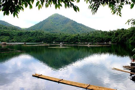 The Seven Lakes of San Pablo namely Sampaloc Lake, Mohicap Lake, Yambo Lake, Pandin Lake, Palakpakin Lake, Kalibato Lake, Bunot Lake are seven crater lakes scattered around the City of San Pablo, in the province of Laguna. In 2005, the Rotary Club of San Pablo City held a ceremony that officially opened the hiking trails that connect the seven lakes of the city. The Rotarians were aiming for economic, environmental and health benefits of the trails to the community. Laguna Philippines, Philippines Destinations, Jose Rizal, Body Of Water, Crater Lake, Downtown Chicago, Beautiful Destinations, Hiking Trails, Places Ive Been