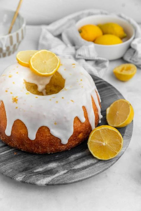 This easy moist lemon bundt cake with lemon glaze and icing is so good. It's a King Arthur Flour recipe and it's one of my favorite lemon desserts ever. A must make! #lemon #lemoncake #citrus #citrusdesserts #lemonbundt Lemon Glaze Cake, Delicious Lemon Cake, Lemon Poppyseed Cake, Lemon Syrup, Lemon Bundt Cake, Lemon Icing, Full Fat Yogurt, Bundt Cake Pan, Leftover Cake