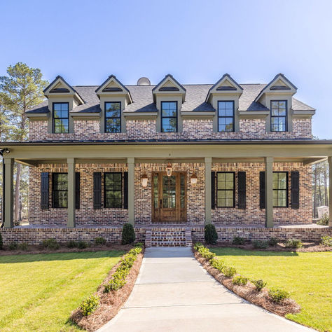 Andersonville Brick on the exterior of a house Craftsman Brick Exterior, Modern Red Brick House, Farmhouse With Brick, Rustic Brick House Exterior, Brick Modern Farmhouse, White Stone House Exterior, Brick Homes Exterior, Brick Farmhouse Exterior, Brick Colonial House