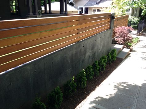 Wood Trellis On Top of Concrete Retaining Wall Retaining Wall Design, Wood Fence Design, Privacy Wall, Wood Trellis, Fence Toppers, Concrete Retaining Walls, Modern Fence Design, Privacy Fence Designs, Cheap Fence