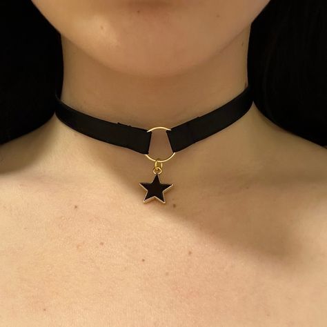 Choker is adjustable, and has a hook at the back. Introducing our celestial-inspired choker adorned with a delicate star charm, evoking the enchanting allure of the night sky. Crafted with precision and elegance, this choker gracefully encircles the neck, adding a touch of celestial glamour to any ensemble. With its subtle yet captivating design, it serves as a symbol of cosmic beauty and personal style. Elevate your look with this charming accessory that captures the magic of the stars. Star Choker Necklace, Choker Necklace Black, Star Choker, Goth Choker, Choker Necklace Designs, Face Piercings, Charm Choker Necklace, Leather Choker Necklace, Black Choker Necklace