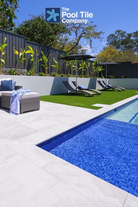 Fresh summer tones in Ash Marblano Porcelain coping and surrounds, with CMC300 waterline, step edge and seat from The Pool Tile Company. Pool Surrounds, Summer Tones, Stone Feature Wall, Pool Inspiration, Porcelain Pavers, Mosaic Pool Tile, Pool Pavers, Outdoor Porcelain Tile, Stone Pool