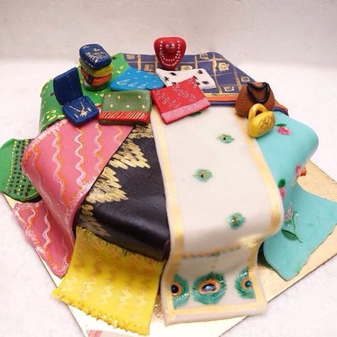 Collection of sarees on a cake for a mom from her daughter! Birthday Cake For Daughter From Mom, Saree Cake Design, Cake For Foodie Theme, Saree Theme Cake, Cake Designs For Mom Birthday, Birthday Cake For Mom Unique, Saree Cake, Birthday Cake For Daughter, Saree Packing