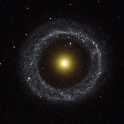 Hoag’s object - Hoag's Object is an unusual ring galaxy in the constellation of Serpens Caput. It is named after Arthur Hoag, who discovered it in 1950 and identified it as either a planetary nebula or a peculiar galaxy. The galaxy has approximately eight billion stars, and is roughly 120,000 light years across.  Many of the galaxy's details remain mysterious, foremost of which is how it formed. So-called "classic" ring galaxies are generally formed by the collision of a small galaxy with a ... Hoag's Object, Galaxy Collision, Planetary Nebula, Nebula Galaxy, Cosmic Horror, Unusual Rings, Light Year, Classic Ring, The Galaxy