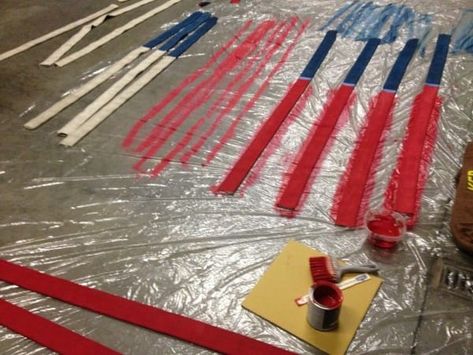 They painted red onto 7 of the strips, keeping the remaining 6 ones the original white hose color. Firehose Flag Diy, Fireman Quilt, Fire Hose Projects, Fire Hose Crafts, Fire Dept Decor, Fireman Crafts, Diy American Flag, Firefighter Life, Firefighter Crafts