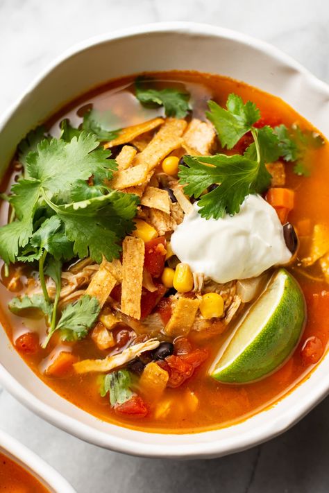 This Mexican chicken soup is easy to make, healthy, and delicious! It's packed with flavor. Everyone will love to load their bowls up with toppings like sour cream, tortilla strips, cilantro, and avocado. Gf Soups, Mexican Lunch, Poulet Tikka Masala, Apartment Recipes, Mexican Chicken Soup, Mexican Soup Recipes, Salt Lavender, Kung Pao Chicken Recipe, Braised Chicken Breast