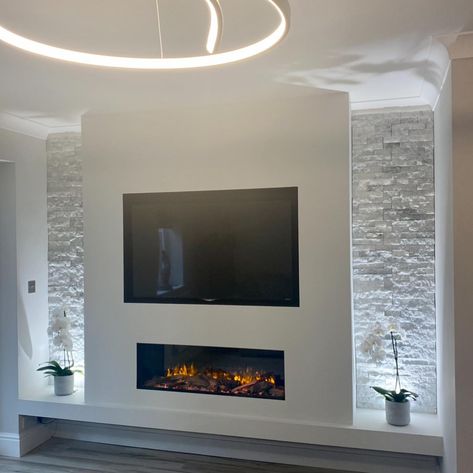 Another fantastic transformation…..our client felt the room lacked a feature in their square room…..we designed a media wall to incorporate… | Instagram Media Wall Fireplace Tv, Feature Media Wall, Media Walls With Electric Fires, Media Wall Grey, Media Wall Inspiration, Living Room Decor Grey Carpet, Media Wall Christmas Decor, Media Walls Ideas, Media Wall Ideas Without Fireplace