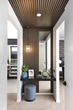 Interior Timber Panelling, Timber Accents Interior Design, Entry Slat Wall, Bathroom Timber Panelling, Slat Wall And Mirror, Entryway To Master Suite, Mirror In Mudroom Entrance, Drop Zone Styling, Bedroom Drop Zone