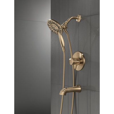 Inspired by modern architecture, the Albion Collection brings dimensional style to your bath with a soft touch of curves rooted in angular geometries. The Delta® In2ition® Two-in-One Shower features a detachable hand shower that can be used separately from or simultaneously with the shower head. This integrated dual-functionality gives you maximum flexibility without sacrificing warmth, as you can choose to have water streaming from the shower head only, the hand shower only, or both the shower Champagne Bronze Shower Fixtures, Bronze Shower Fixtures, Dual Shower Heads, Shower Fixtures, Shower Faucet Sets, Tub Shower, Champagne Bronze, Tub And Shower Faucets, Bathtub Shower