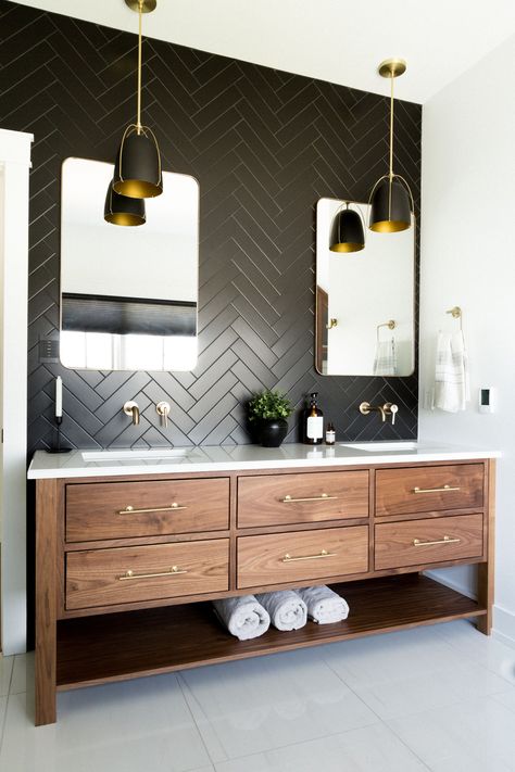 Transitional Design with a Black Herringbone Tile Bathroom Backsplash and Wood Vanity Design
The brass accents and the black herringbone tile bathroom backsplash wall create such an elegant and eye-catchy look. Black Herringbone Tile Bathroom, Black Herringbone Tile, Herringbone Tile Bathroom, Masculine Bathroom, Bathroom Redesign, Transitional Bathroom, Master Bath Remodel, Black Tiles, Bathroom Backsplash