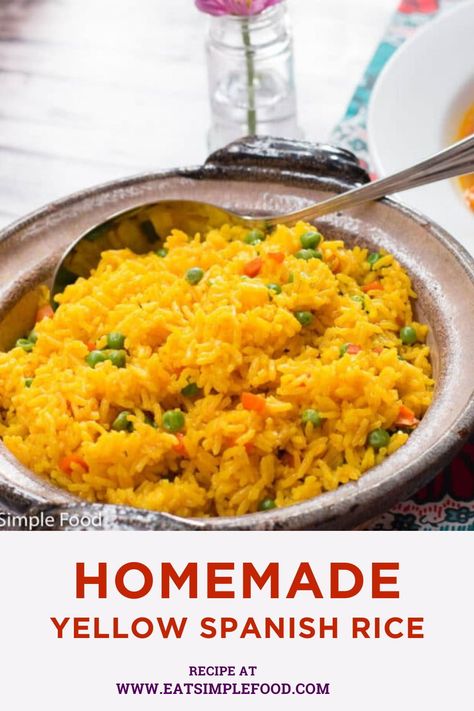 This easy homemade yellow Spanish rice recipe (AKA Arroz Amarillo) is a colorful and versatile side dish with peas and carrots. The yellow rice color comes from the addition of a little bit of saffron or turmeric. Homemade Yellow Rice Recipe, Latin Rice Recipes, Spanish Yellow Rice Recipe Puerto Rico, Best Yellow Rice Recipe, Yellow Rice With Vegetables, Diy Yellow Rice, Yellow Spanish Rice Recipe, Spanish Rice With Corn, How To Make Yellow Rice