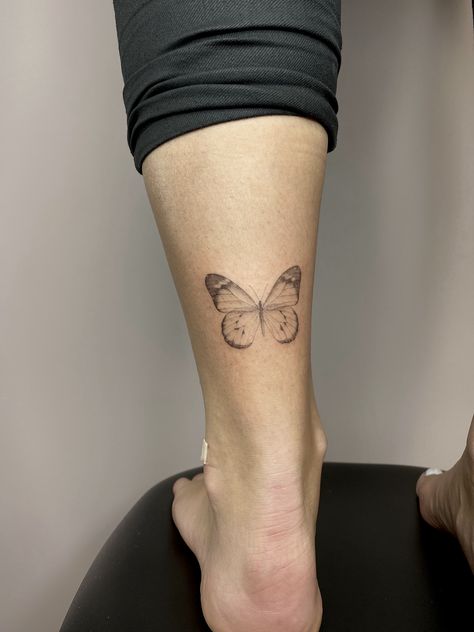 Back Of Ankle Butterfly Tattoo, Butterfly Tattoo Back Of Leg, Microrealism Butterfly Tattoo, Soft Butterfly Tattoo, Light Butterfly Tattoo, Butterfly Fine Line Tattoo, Butterfly Tattoo Fine Line, Butterfly Tattoo Leg, Fineline Butterfly Tattoo