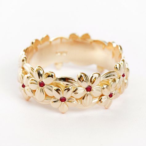 "Original Silly Shiny Diamonds Design Floral Hawaiian Dainty Gold and Ruby Wedding Ring - \" Jungle Ring\"  Diamonds can be switched to: sapphires, emerald, aquamarine, black diamonds, contact me for a quote. Product details:  ♥ Natural Ruby 0.10 carat. ♥ Ring width 7mm  Please selected your wanted gold color, purity and ring size at menu drop down.    ----------- ♥ SHIPPING, JEWELRY CERTIFICATE AND MAKING TIME ----------  ♥ Free first class shipping worldwide   ♥ We offer with every jewel IGL J Hawaiian Ring, Flower Wedding Band, Unique Wedding Jewelry, Floral Wedding Ring, Ruby Wedding Band, Ruby Wedding Rings, Emerald Wedding Band, July Birthstone Ring, May Birthstone Rings