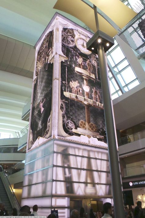 Los Angeles International Airport (LAX) - Another face to the clock tower located inside the new Tom Bradley International Terminal taken on Tom Bradley International Terminal, Feature Column, Media Tower, Led Signage, Mall Design, Commercial Street, Los Angeles International Airport, Lift Design, Artistic Installation