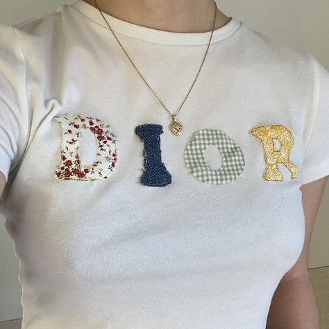 I might be biased but you should probably buy this on Depop 👍 https://depop.app.link/cEJ9wyBNMyb Sewn Letters On Shirt, Fabric Letter Shirt, Diy Baby Tee Ideas, Sewing Letters On Fabric, Patchwork Letter Shirt, Patchwork Baby Tee, Diy Baby Tee, Sewing Projects Aesthetic, Embroidery Tshirt Ideas