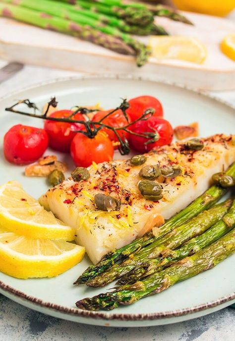 Elevate your weeknight dinners with this Easy Mediterranean Cod and Asparagus recipe, where simplicity meets vibrant Mediterranean flavors. This dish features tender cod fillets roasted to perfection with a blend of aromatic herbs and zesty lemon, creating a meal that’s both light and satisfying. Paired with fresh, crisp asparagus, this recipe brings together a harmonious mix of textures and tastes, making it the perfect choice for anyone seeking a quick yet delicious meal. Fish And Asparagus Recipes, Cod And Asparagus, Fish And Asparagus, Stuffed Cod, Crisp Asparagus, Mediterranean Cod, Cod Fillets, Mediterranean Flavors, Keto Dinners