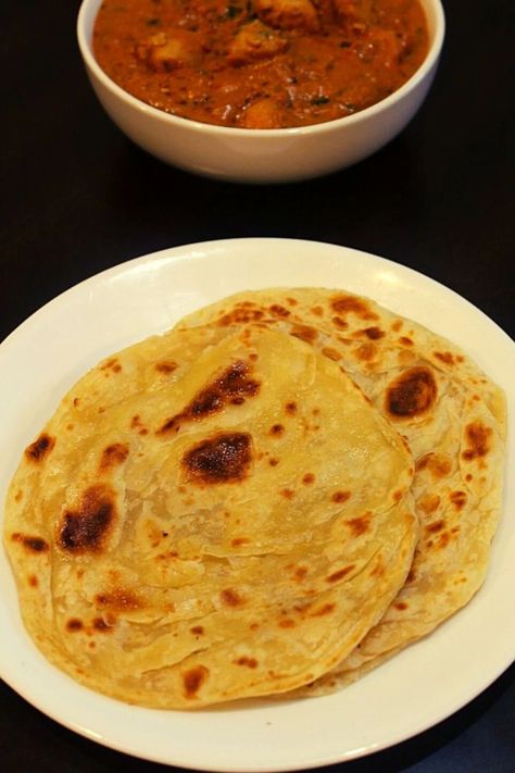 Parotta recipe, a south indian flat bread made using all purpose flour, milk and egg which is rolled as a chapathi and roasted on tawa. #quickandeasy #easyrecipe #dinnerrecipes Malabar Paratha, Parotta Recipe, Indian Flat Bread, Indian Kitchen, Flat Bread, All Purpose Flour, Flatbread, How To Make Bread, Purpose Flour