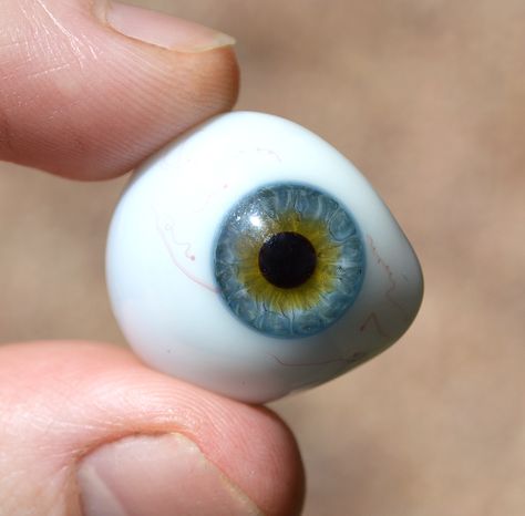 This prosthetic eye was hand blown by a German glass artisan nearly 100 years ago! An amazing piece of craftsmanship, with exceptionally realistic colors, and details. Outer edge of the iris is a beautiful blue color, with a slight hint of hazel & brown seeping out from around the pupil. Prosthetic Eye Aesthetic, Sean Core, Eye Prosthetic, Prosthetic Eye, Alien Comic, Sports Science, Monster Eyes, Sally Face, Character Aesthetics