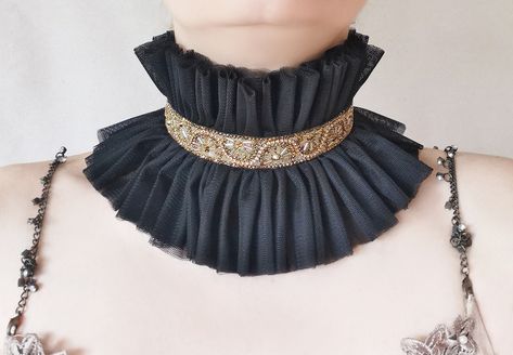 Rococo style hold trimming collar with ruffles for Photoshoot Model or Party, tulle beaded high choker in black with beautiful beaded trimming by Elyseeart. Unique stage costume high neck collar. ♥ Materials: hand sewn layered high quality soft tulle fabric, Rococo style beaded trimming in beautoful shades of antique gold-bronze. Adjustable on neck circle with tulle ties. Each ruffle is hand sewn. *non scratchy tulle, soft and friendly on skin for many hours. *non itchy tulle One size fits all. Queen Photoshoot, Costume Collar, Ruff Collar, Photoshoot Props, Stage Costume, Black Tulle, Soft Tulle, Rococo Style, Ruffle Collar