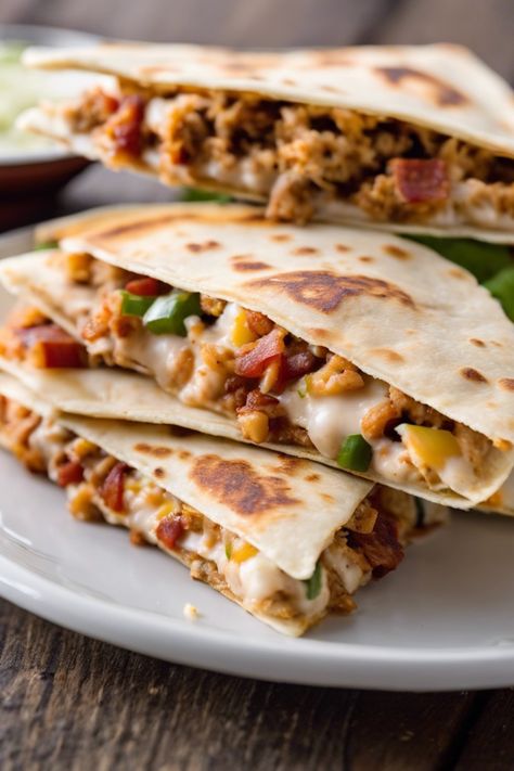 Deliciously savory and oh-so-tasty! Explore the irresistible world of ground chicken and bacon recipes with our collection of mouthwatering dishes. From the indulgent flavors of ground chicken and bacon lasagna to the juicy goodness of ground chicken bacon ranch burgers, we've got something for every palate. Craving a Tex-Mex twist? Try our tempting bacon ranch ground chicken quesadillas. Looking for a quick fix? Ground Chicken And Bacon Recipes, Ground Chicken Recipes For Dinner Easy, Bacon Ranch Burgers, Chicken And Bacon Recipes, Bacon Lasagna, Chicken Ranch Tacos, Ranch Burgers, Baked Tacos Recipe, Pizza Roll Up