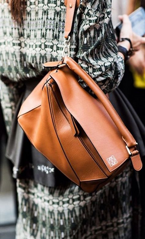 Loewe's tan leather puzzle bag worn as a backpack Loewe Puzzle Bag Outfit, Loewe Puzzle Bag Small, Loewe Puzzle Bag, Lululemon Bags, Loewe Puzzle, Winter Bags, Puzzle Bag, Loewe Bag, Latest Bags