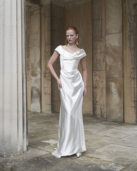 The 2025 Made-to-Order Bridal collection is built upon the house foundations and features eight new gowns and a series of separates and accessories. Each gown is designed to be transformed. The collection is presented as an ode to love: an honour to the everlasting vow. Queen Victoria provided the original inspiration for the 2025 collections, as the first bride to choose white for her wedding gown, breaking with tradition and showing a fierce, independent spirit. Vivienne Westwood Bridal, Vivienne Westwood Wedding Dress, Vivienne Westwood Wedding, Wedding Gown Brand, The Vivienne, Wedding Gowns Vintage, Satin Wedding Dress, Winter Wedding Dress, Queen Victoria