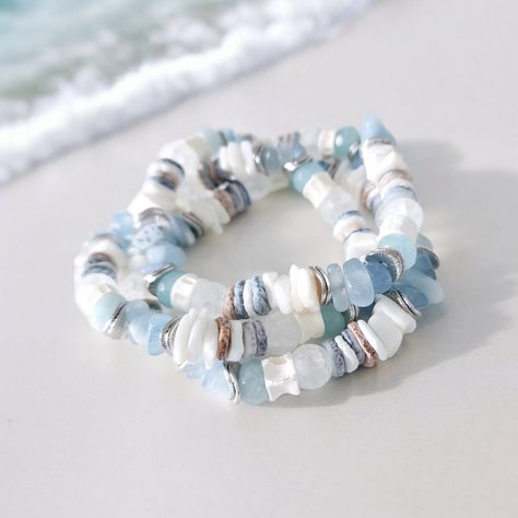 Handcrafted with meticulous care, this beach bracelet includes sea glass, shell, silver, aquamarine, and unique fish bone vertebrae beads handmade in Africa. Each element tells a story of the sea, from the intricate fish bone bead to the shimmering sea glass bead, creating a unique piece that captures the essence of ocean treasures. The delicate silver accents add a touch of sophistication, complementing the natural beauty of the shell bead to perfection. Perfect for a beach wedding or as a stat Beaded Beach Necklaces, Beach Inspired Jewelry, Glass Bead Bracelet Patterns, Hawaii Bracelets, Gemstone Bracelets Ideas, Glass Bead Bracelet Ideas, Bracelet Design Ideas, Sea Glass Jewelry Diy, Beach Theme Jewelry