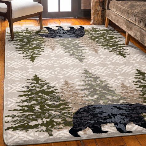 Handsome pine trees frame this stoic bear who is highlighted by charcoal high lights. The patterned field adds another layer of dimension to this iconic cabin rug. Proudly made in the USA. American Dakota Modern/Contemporary 5 x 8 Ft. Stone Indoor Lodge Area Rug | 0420STN201 Modern Lodge Decor, Northwoods Decor, Cabin Rug, Farmhouse Style Living Room Decor, Cabin Christmas Decor, Mountain House Decor, Cabin Rugs, Cabin Theme, Bear Cabin