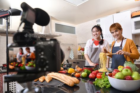 Mother and daughter cooking in the kitchen by amenic181. Mother and daughter blogger vlogger and online influencer recording video content on healthy food #Sponsored #blogger, #vlogger, #kitchen, #Mother Cooking Influencer, Mother And Daughter Cooking, How To Start Youtube, Cooking In The Kitchen, Recording Video, Video Content Marketing, Youtube Cooking, Food Stock, Youtube Channel Ideas