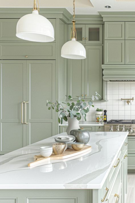 Check out these 30 sage green kitchen cabinets ideas for a modern farmhouse vibe! Sage green cabinets add a touch of calm and elegance to any kitchen, creating a perfect blend of modern style and rustic charm. Whether you're going for a cozy farmhouse feel or a sleek contemporary look, these cabinet designs will inspire your next kitchen makeover. Sage Green Kitchen Cabinets Silver Hardware, Kitchen Inspirations Green Cabinets, Green Kitchen Cabinets Silver Hardware, Contemporary Kitchen Design Ideas Modern, Light Sage Green Kitchen Cabinets, White And Green Kitchen Cabinets, Light Green Kitchen Ideas, Clary Sage Kitchen Cabinets, Grey And Green Kitchen