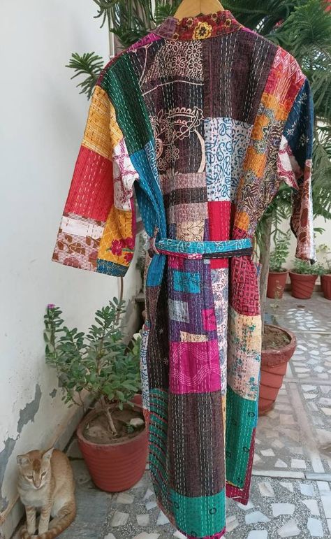 This Kimono is made of hand Kantha stitch fabric in patchwork . The fabric is a handmade printed fabric. Kantha stitch over the fabric gives it a unique look. It is two Layer of Cotton Kantha Stitch (Hand Quilted) Fabric Robe Size : Free size Length: 50 Inch ( 125 Cms.). Long Patchwork Festival Kimono, Spring Bohemian Patchwork Robe, Bohemian Multicolor Patchwork Robe, Patchwork Dressing Gown, Long Sleeve Cotton Patchwork Kimono, Quilted Jacket Pattern, Boro Stitching, Quilted Clothes, Patchwork Clothes