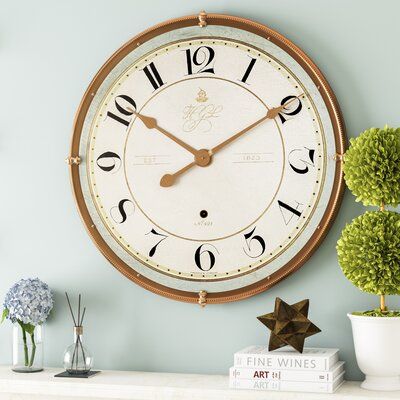 From pocket watches to grandfather clocks, a timepiece is a great way to add personality to your space. Tell time in style with a clock like this: featuring antiqued accents, it's perfect for any room looking for a traditional touch. It's antique bronze spade hands are operated by a quartz crystal mechanism with a silent motor, so it can tell time without interrupting yours with constant ticking. The face measures 31.5'' in diameter, so finding the hour is easy, even from across the room. | Grey Grandfather Clocks, Kitchen Wall Clocks, Oversized Wall Clock, Furniture Classic, Wayfair Furniture, Antique Plates, Grandfather Clock, Wood Wall Clock, Traditional Furniture