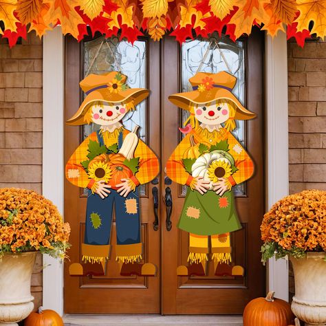 PRICES MAY VARY. Fall Scarecrow Decoration: you will receive 2 fall scarecrow wall plaques, designed as boy and girl figures, they are holding pumpkins, sunflowers and etc., to add fall fun for you and your family, friends, or neighbors Quality and Reliable Material: our fall front door hanging signs are made of quality wood material, sturdy and reliable, nice texture, with bright colors, not easy to crack or fade, can be applied for multiple holidays Appropriate Size: fall hanging fun scarecrow Front Porch Decor Fall Simple, Thanksgiving Outside Decorations, Dollar Tree Stacked Pumpkins, Fall Booth Displays Vintage, Fall Classroom Door Decorations, Diy Scarecrow Decoration, Door Signs Fall, Fall Front Door Decorations, Fall Wagon Decor