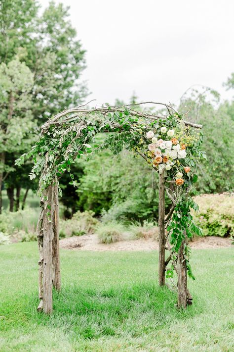 Rustic Fairytale Wedding Arch - A Whimsical Spring Wedding Inspiration #rusticfairytaleweddingarch #fairytaleweddingarch #rusticweddingarbor #rusticweddingceremonybackdrop #fairytaleweddingceremony #whimsicalspringweddinginspiration Woodsy Wedding Arbor, Cedar Arch Wedding, Forest Wedding Arches, Wedding Arch Ideas Forest, Natural Wedding Arbor, Whimsical Wedding Arbor, Forest Wedding Arbor, Wedding Arch Natural, Fantasy Wedding Arch