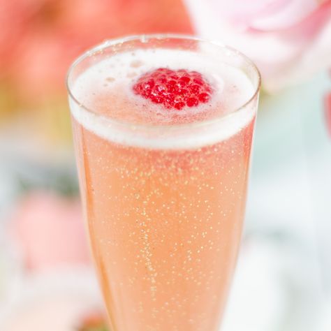 Make the bride’s big day even more exciting with a cocktail that will sweep her off her feet! So simple to put together, this crisp, refreshing drink is as pretty as it is delicious. Combine 1 oz. Daily’s Raspberry Mix, 2 oz. champagne, 1-2 oz. vodka with a splash of Daily’s Sweet & Sour Mix. Strain into champagne glasses and garnish with mint sprig or cotton candy. Cheers! Pink Bridal Shower Drinks, Blushing Bride Drink Recipe, Vodka Wedding Cocktails, Bride Cocktail Drinks, Blushing Bride Drink, Blushing Bride Cocktail, Cotton Candy Martini, Raven Wedding, Cotton Candy Wedding