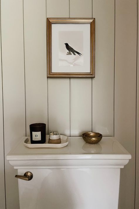 I’m so happy to share our main-floor powder room bathroom remodel, which has become one of my favorite home improvement projects so far! For our small bathroom makeover, we went with a classic, timeless, and traditional look, and I love how this simple bathroom design turned out. Click through for all the details on our bathroom paint color, floor tiles, décor, and more. DIY interiors bathroom, bathroom before and after. Powder Room All One Color, Small Bathroom Ideas Above Toilet, Nickel Gap Bathroom Wall, Black And White Cottage Bathroom, Cheap Bathroom Wall Ideas, Historic Bathroom Ideas, Kate Moss Bathroom, Employee Bathroom Ideas, Neutral Powder Room Ideas