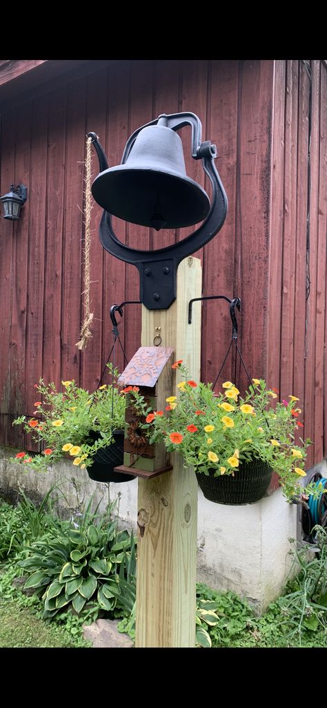 Yard Bell Ideas, Round Fence Post Crafts, Flag Post Ideas, Dinner Bell Outdoor, Dinner Bell Post, School House Bell, Fence Post Crafts, Cast Iron Bell, Themed Garden