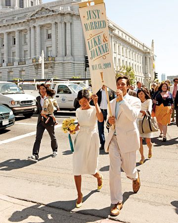 The couple and wedding guests paraded the streets to the reception area w/ banner in hand! cute! Movie Wedding Dresses, City Hall Wedding Dress, Wedding Flags, Wedding Entourage, Informal Weddings, Iconic Weddings, Wedding Movies, City Hall Wedding, Commitment Ceremony